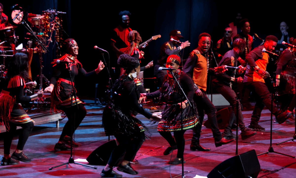 The London African Gospel Choir performing on stage.